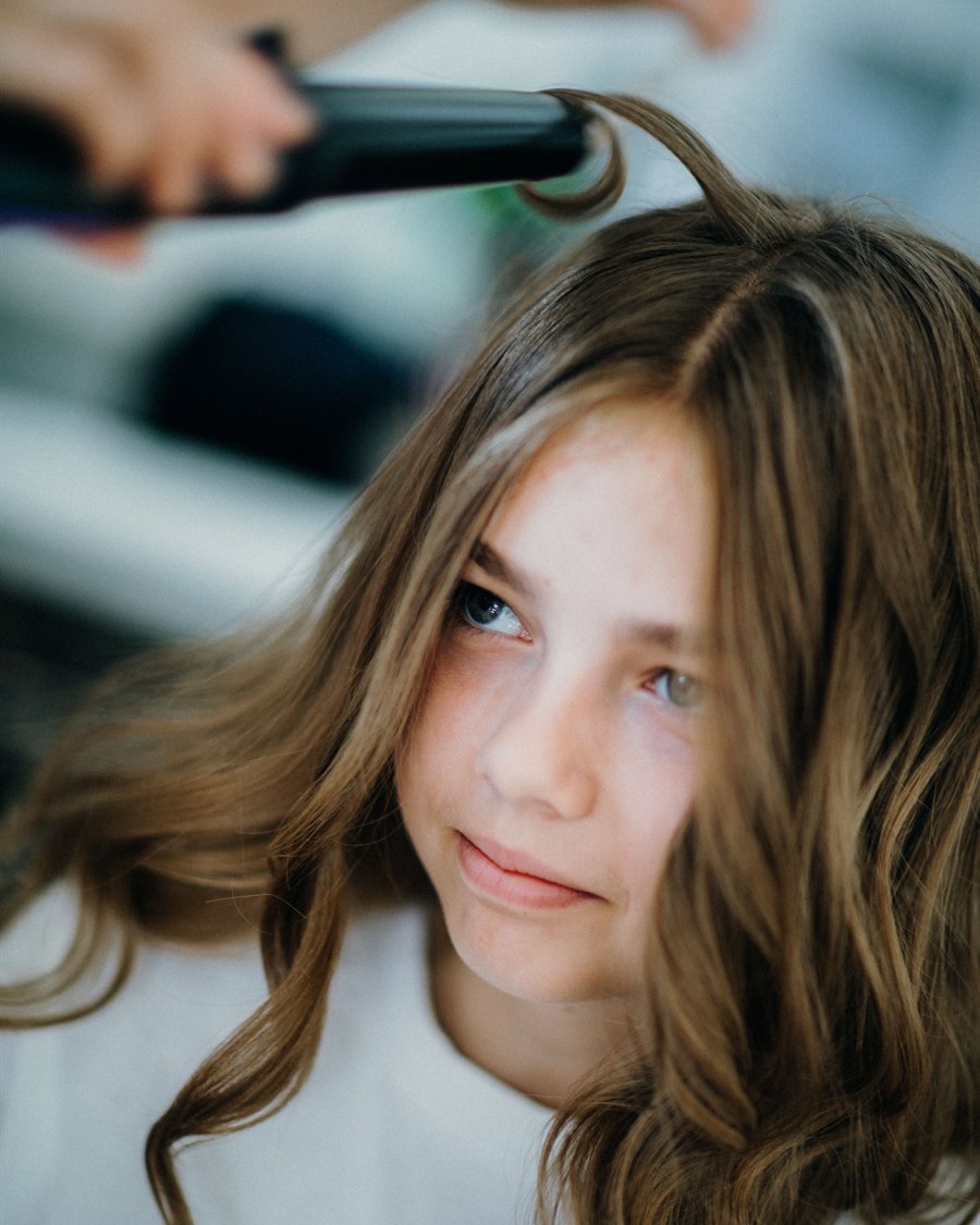 A young client being styled at Servanté Studio