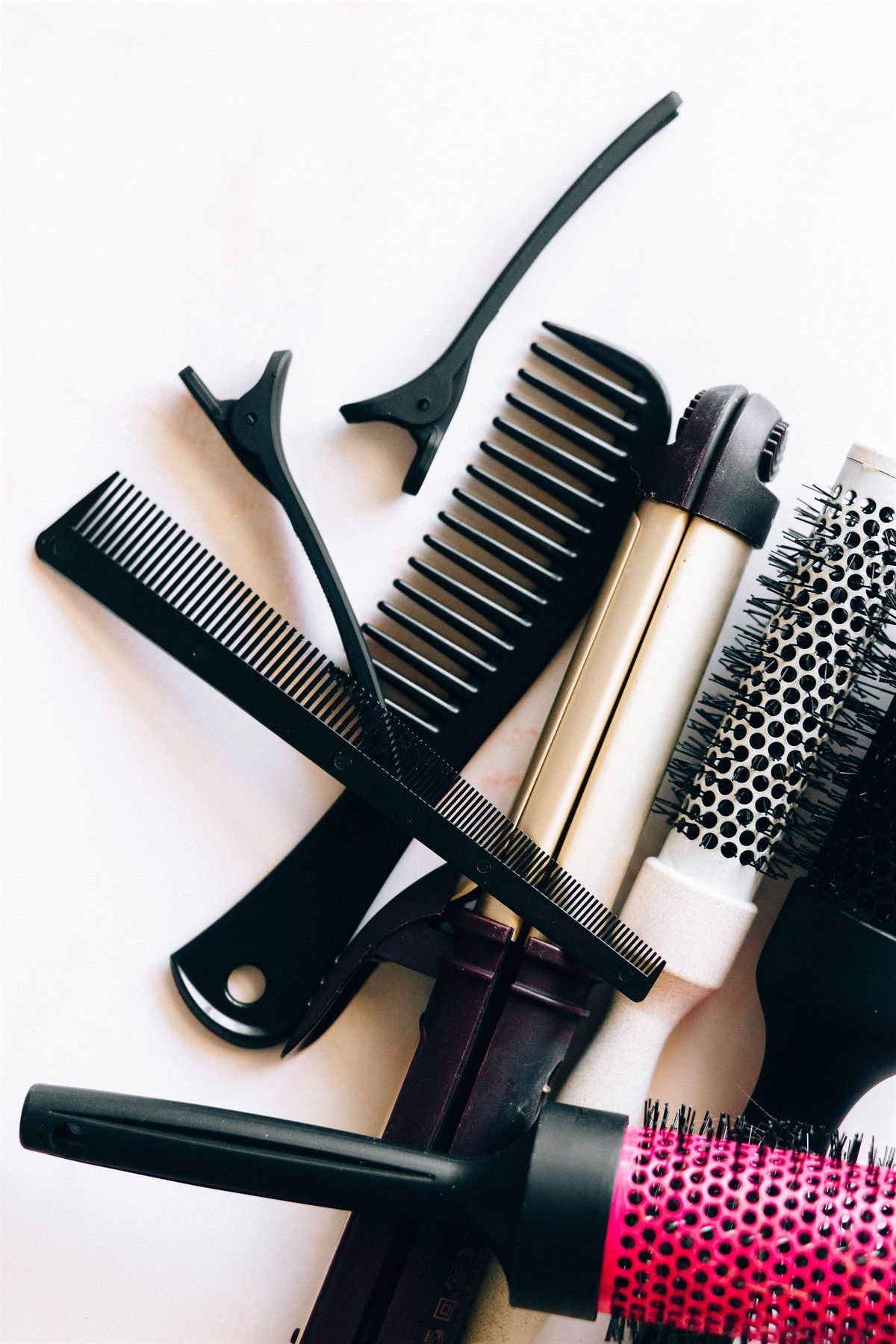 Salon combs, brushes and styling tools arranged neatly
